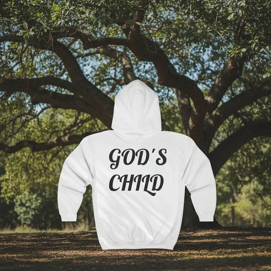 White Christian hoodie with 'GOD'S CHILD' text on the back, placed outdoors against a tree.